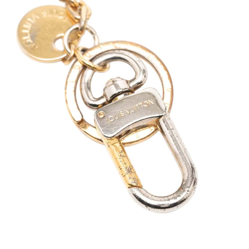 Louis Vuitton Gold Plated and Resin LV Circle Key Holder and Bag Charm Gold Metal Very good condition - Model View