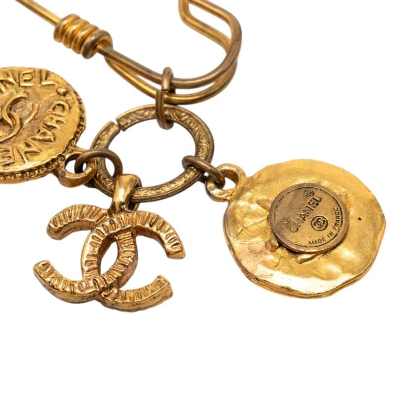 Chanel CC Gold Plated Medallion and Charms Safety Pin Brooch Gold Metal Very good condition - Inside View