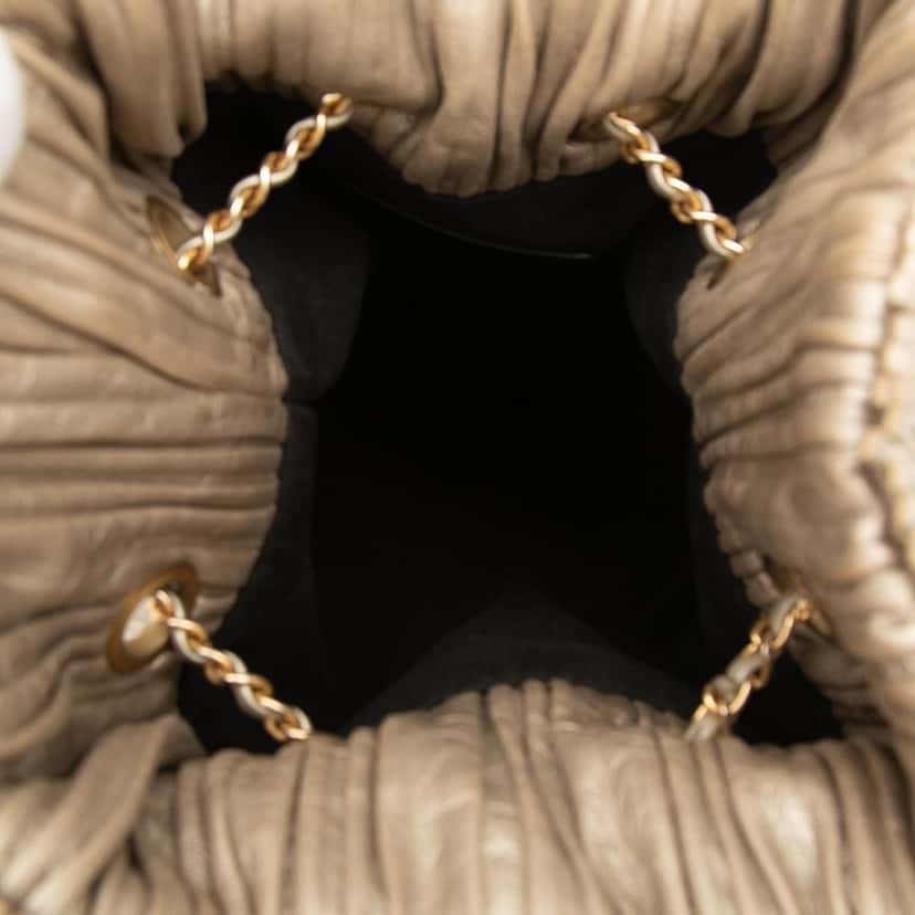 Chanel Small Metallic Calfskin Coco Pleats Drawstring Backpack Gold Leather Very good condition - Model View