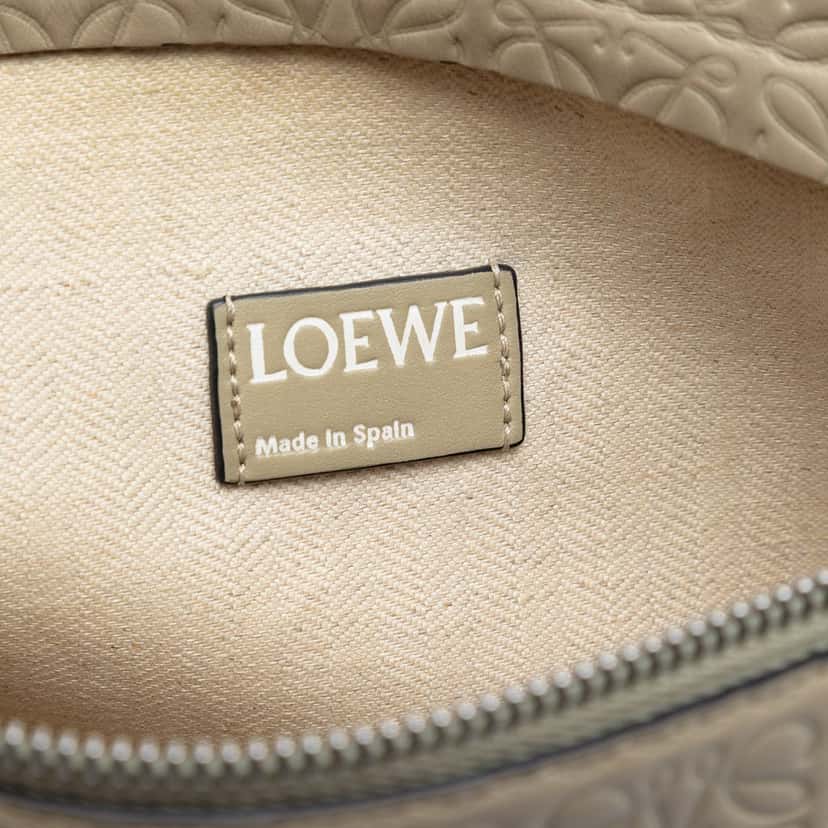 Loewe Embossed Anagram Leather Repeat T Clutch Beige Leather Very good condition - Box View