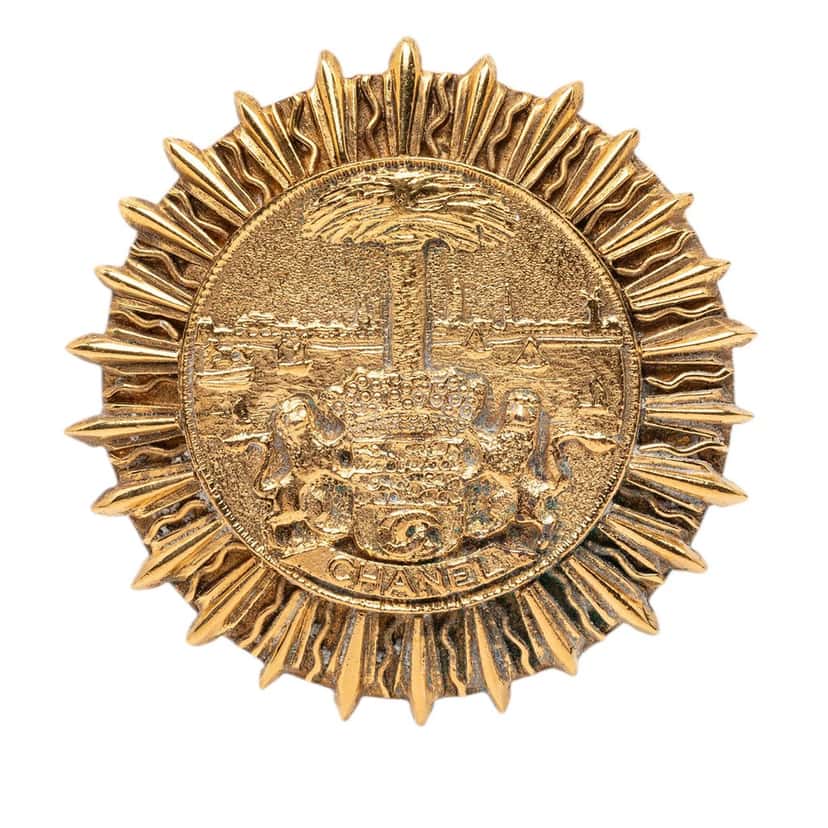 Chanel Gold Plated Coat Of Arms Medallion Sunburst Brooch Gold Metal Very good condition - Front View
