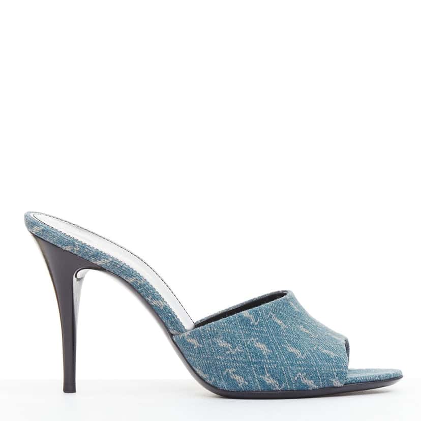 Saint Laurent Step into effortless Parisian chic with these YSL Cassandre mules, featuring all-over tonal YSL logo embroidery in washed denim and a sleek stiletto heel. Blue Denim Very good condition - Front View
