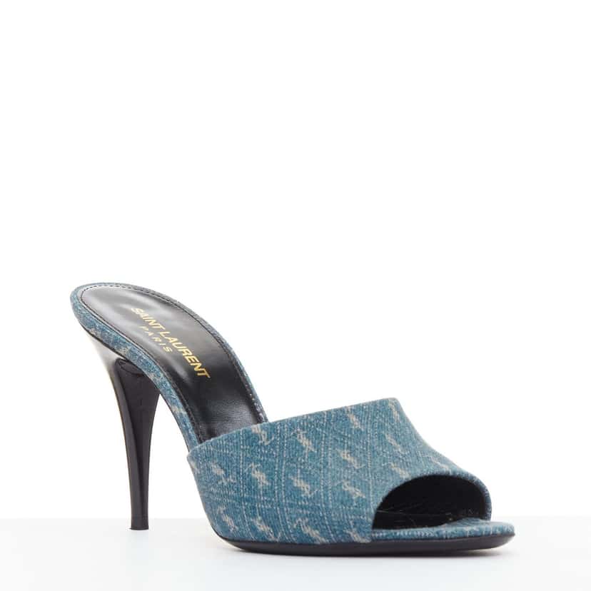 Saint Laurent Step into effortless Parisian chic with these YSL Cassandre mules, featuring all-over tonal YSL logo embroidery in washed denim and a sleek stiletto heel. Blue Denim Very good condition - Back View