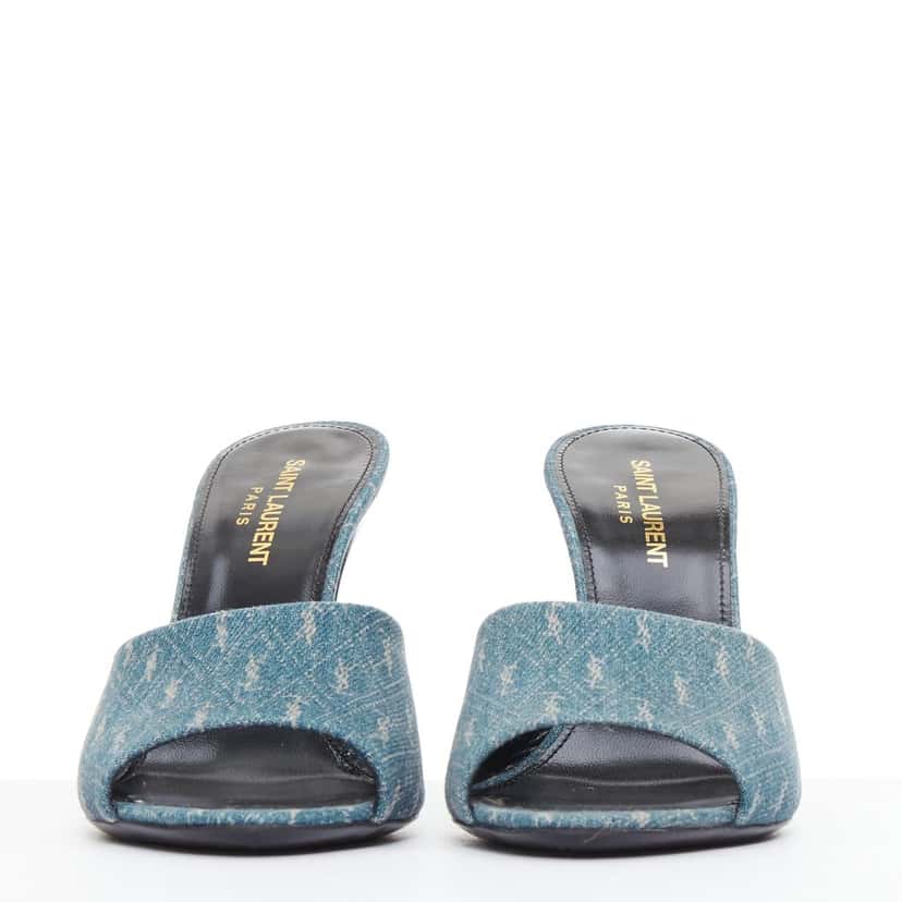 Saint Laurent Step into effortless Parisian chic with these YSL Cassandre mules, featuring all-over tonal YSL logo embroidery in washed denim and a sleek stiletto heel. Blue Denim Very good condition - Inside View