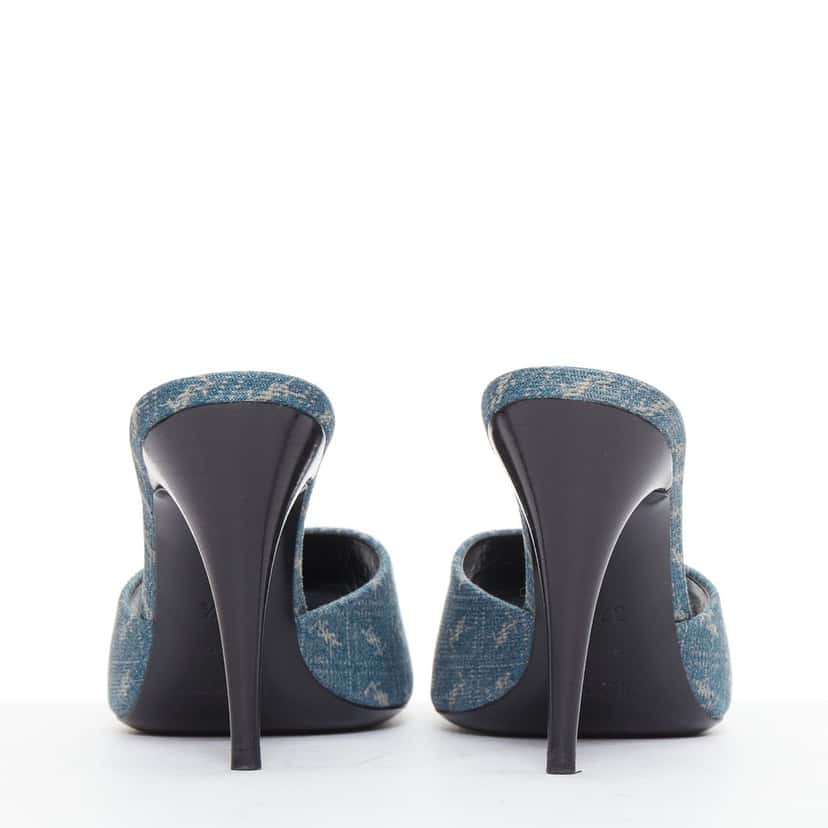 Saint Laurent Step into effortless Parisian chic with these YSL Cassandre mules, featuring all-over tonal YSL logo embroidery in washed denim and a sleek stiletto heel. Blue Denim Very good condition - Box View
