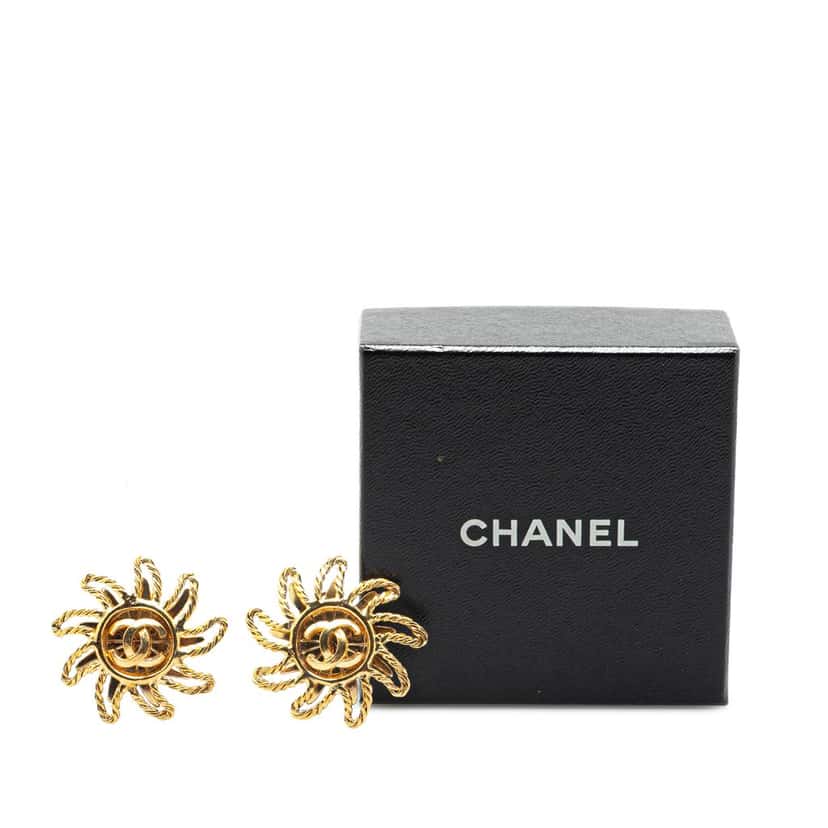 Chanel Gold Plated CC Sun Clip on Earrings Gold Metal Good condition - Model View