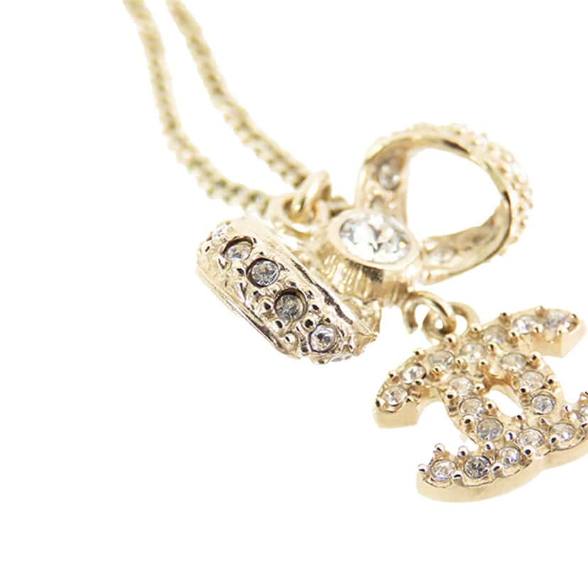 Chanel Gold Plated CC Bow Crystal Pendant Necklace Gold Metal Good condition - Model View