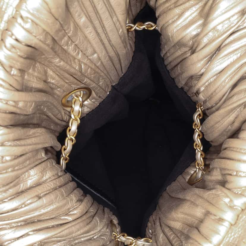 Chanel Medium Metallic Calfskin Coco Pleats Drawstring Backpack Gold Leather Very good condition - Model View