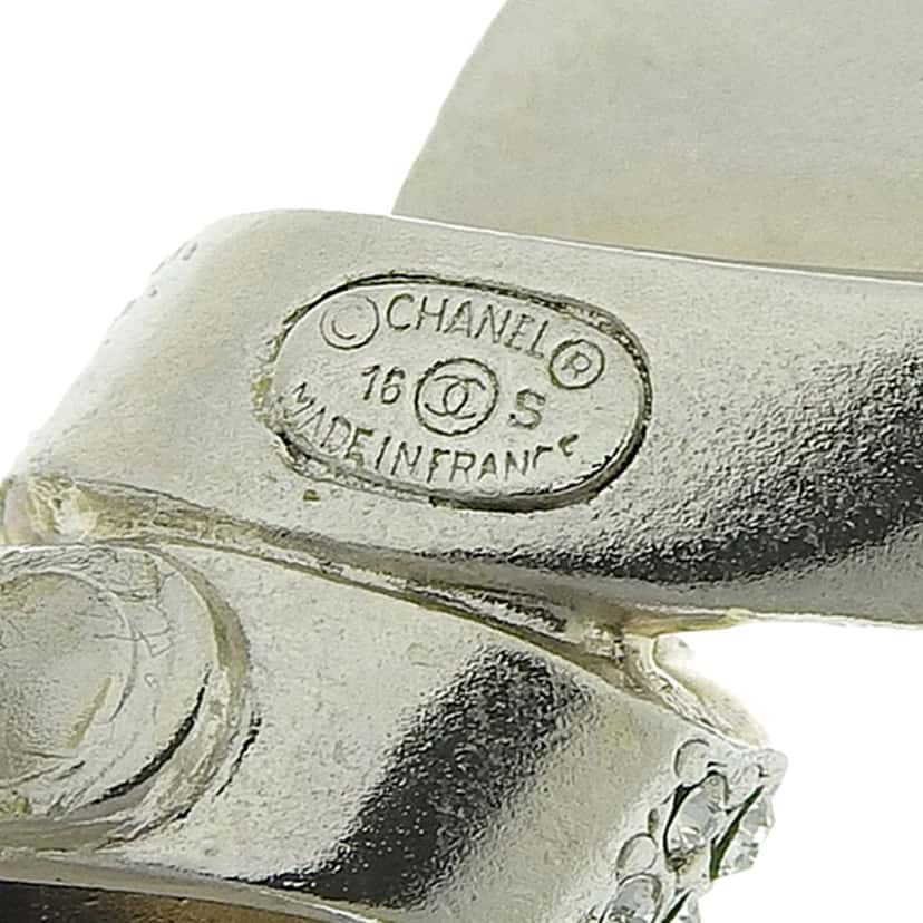 Chanel Silver Rhinestones Ribbon Clip on Earrings Silver Silver Good condition - Model View