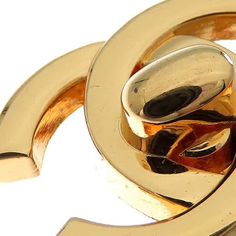Chanel Gold Plated CC Turn Lock Clip on Earrings Gold Metal Good condition - Model View