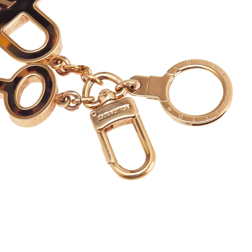 Louis Vuitton Gold Plated and Resin Confidence Bag Charm and Key Holder Gold Metal Good condition - Inside View