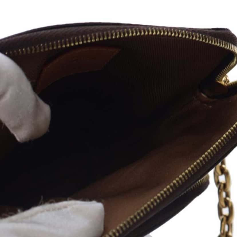 Louis Vuitton Monogram Utility Phone Sleeve Brown Canvas Good condition - Model View