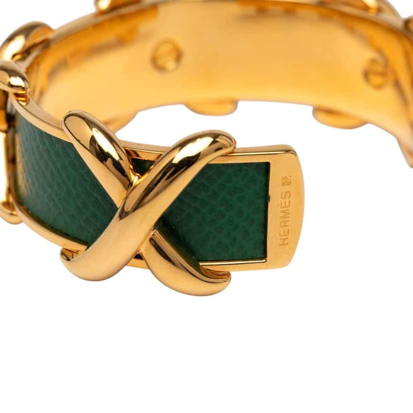 Hermès Gold Plated and Leather Criss Cross Cuff Bracelet Gold Metal Good condition - Model View