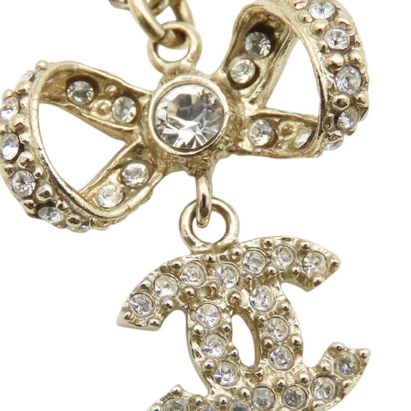 Chanel Gold Plated CC Bow Crystal Pendant Necklace Gold Metal Good condition - Model View