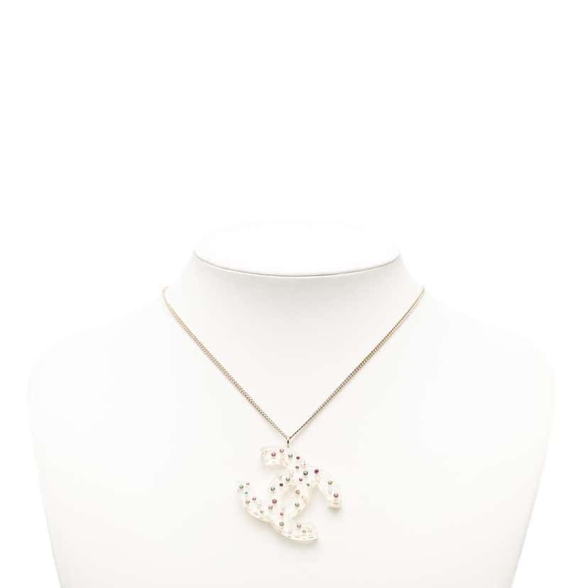 Chanel Gold Plated Resin CC Rhinestone Embellished Pendant Necklace Gold Metal Good condition - Model View