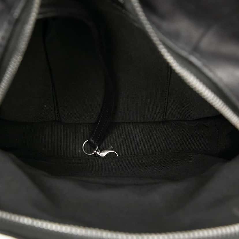 Chanel Small CC Calfskin Drawstring Flap Backpack Black Leather Very good condition - Model View