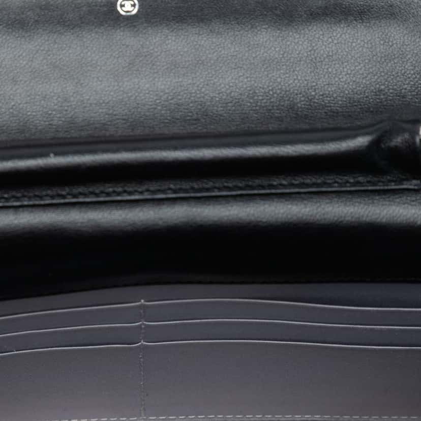 Chanel CC Embossed Lambskin Camellia Wallet On Chain Black Leather Good condition - Model View