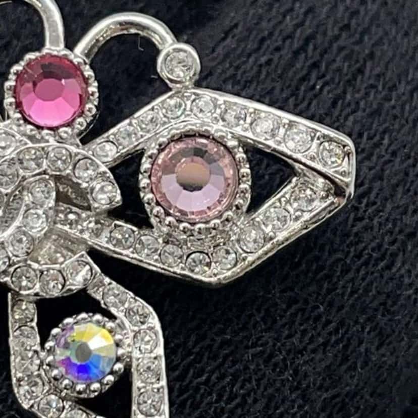 Chanel CC Silver Plated Crystal Butterfly Push Back Earrings Silver Metal Good condition - Model View
