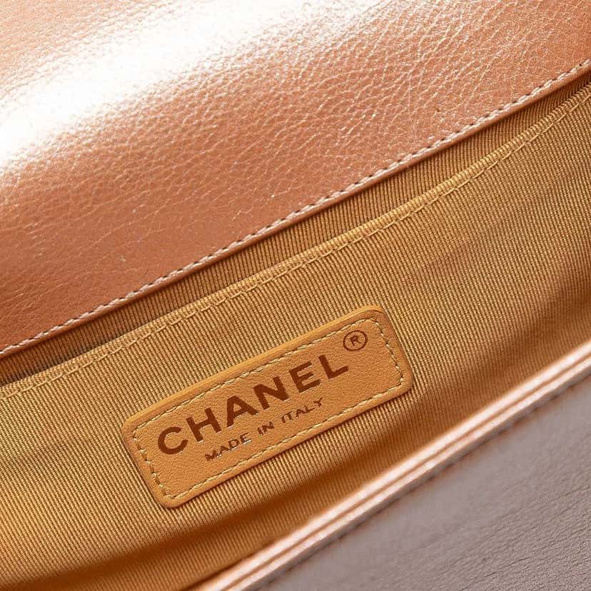 Chanel Small Quilted Metallic Calfskin Boy Flap Orange Leather Good condition - Model View
