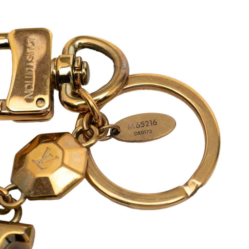 Louis Vuitton Gold Plated LV Facettes Bag Charm and Key Holder Gold Metal Very good condition - Model View
