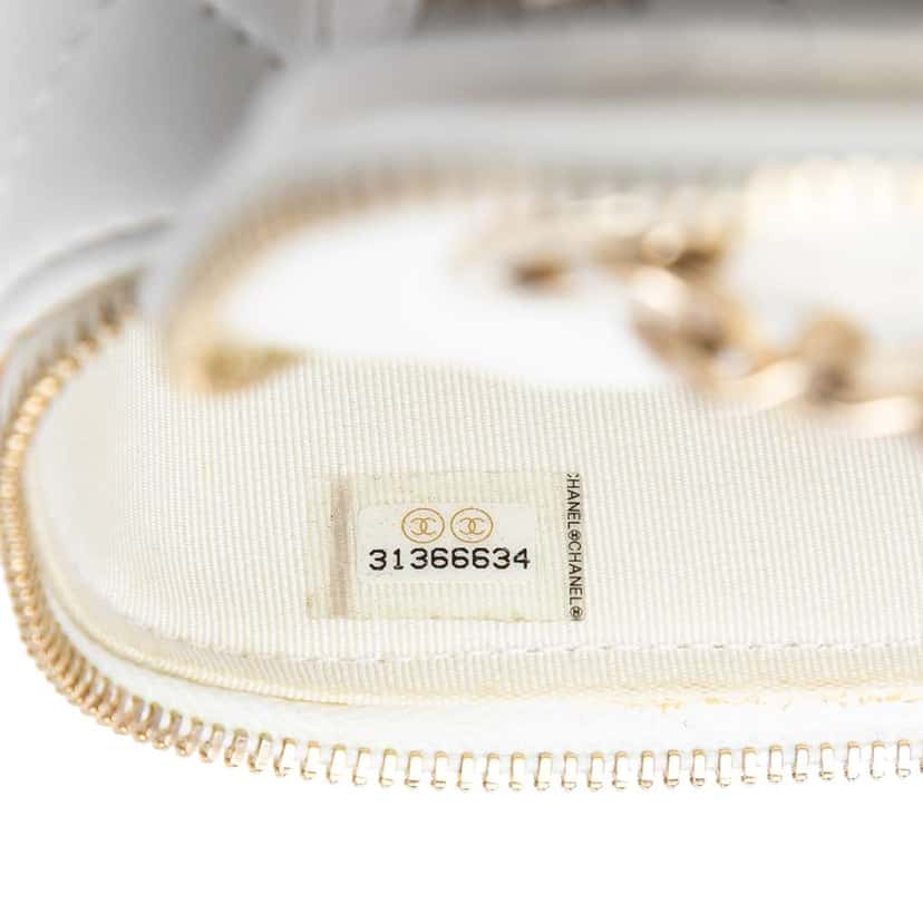 Chanel Mini Quilted Lambskin Camellia Bow Vanity Case with Chain White Leather Very good condition - Box View