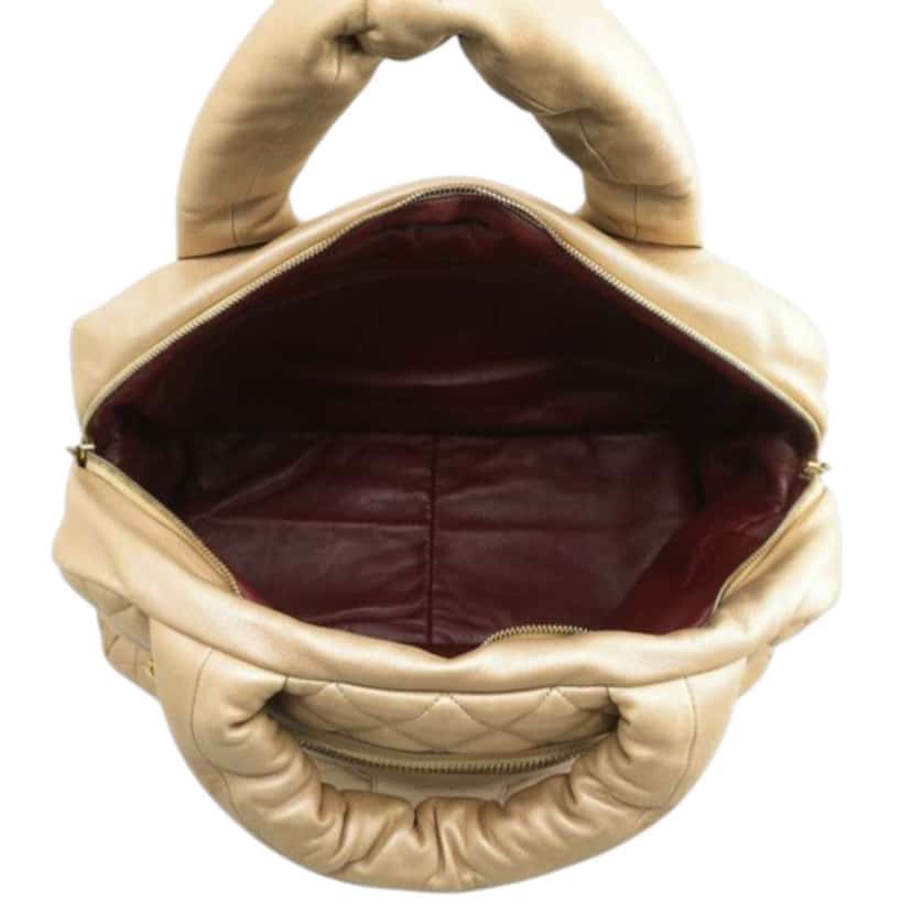 Chanel Quilted Metallic Lambskin Coco Cocoon Bowler Bag Gold Leather Very good condition - Model View