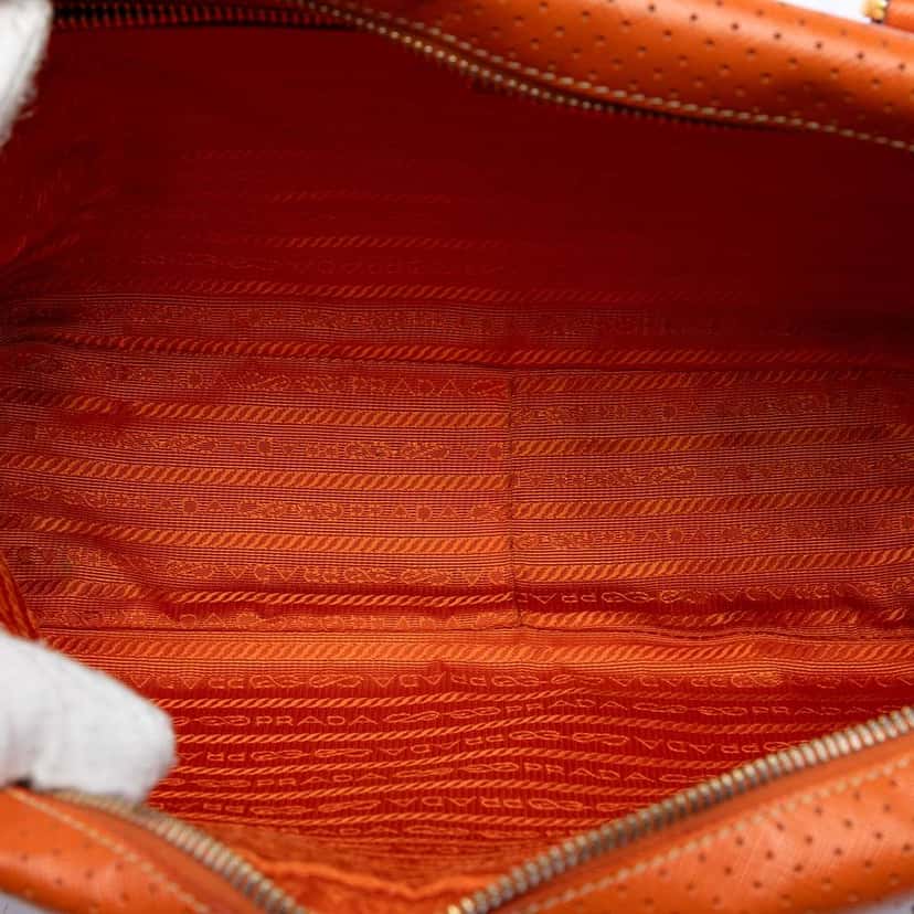Prada Perforated Vitello Drive Leather Bauletto Top Handle Bag Orange Leather Very good condition - Model View