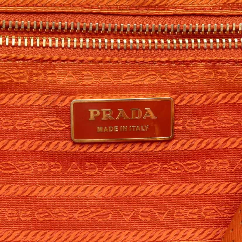 Prada Perforated Vitello Drive Leather Bauletto Top Handle Bag Orange Leather Very good condition - Box View