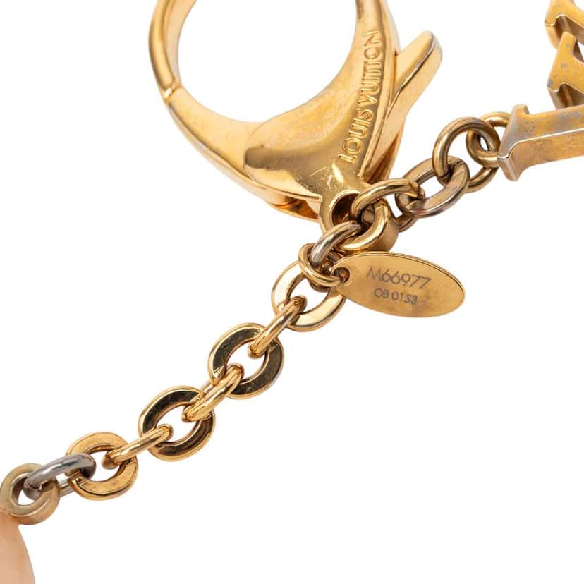 Louis Vuitton Gold Plated and Resin Hollow Flower Key Holder and Bag Charm Gold Metal Fair condition - Model View