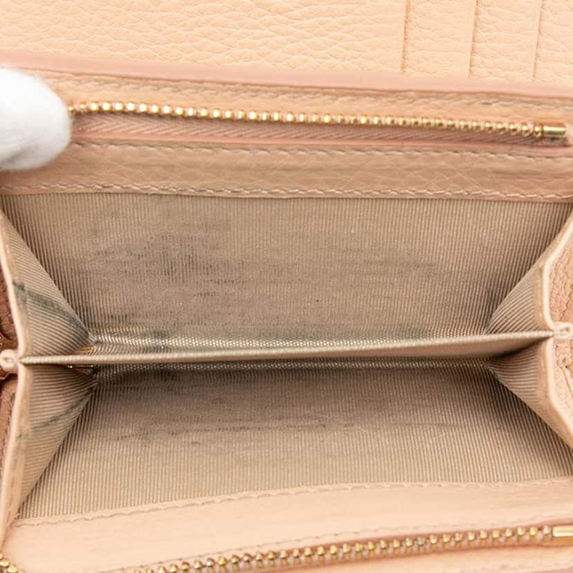 Gucci Small GG Emblem Leather Bifold Wallet Beige Leather Very good condition - Model View