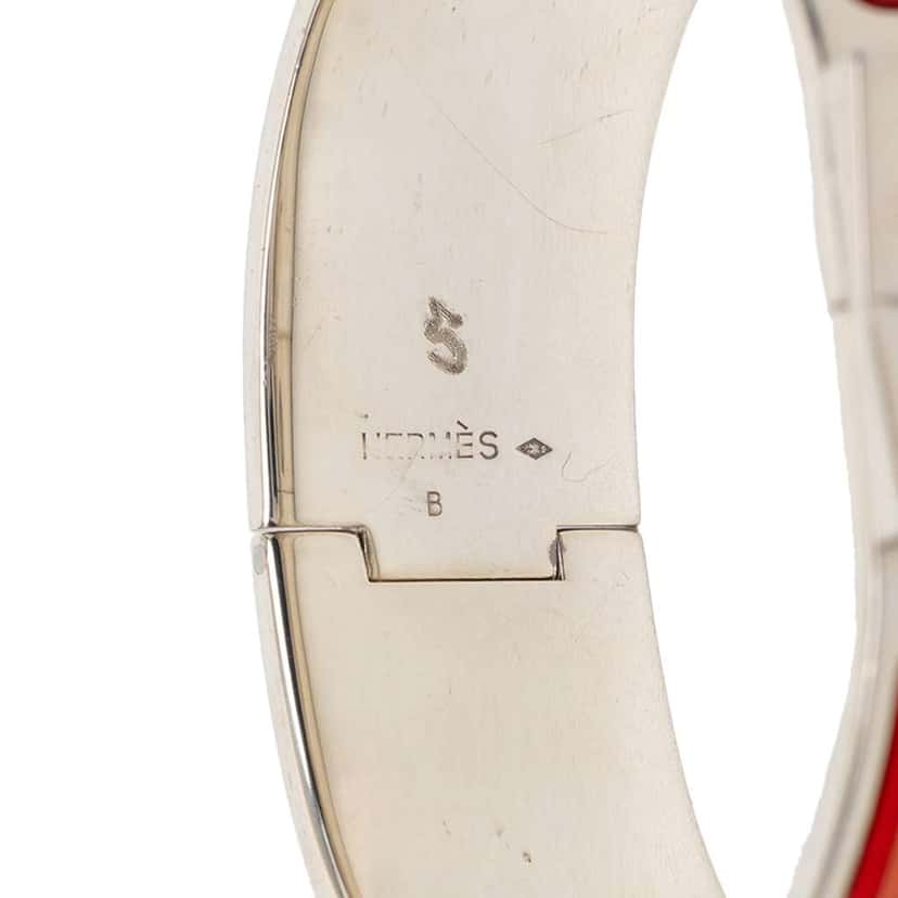 Hermès Wide Enamel Moon and Stars Loquet Bangle Orange Very good condition - Model View
