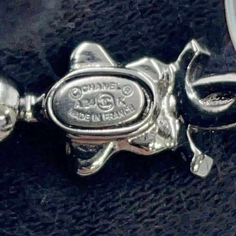 Chanel CC Silver Plated Crystal Star Push Back Earrings Silver Metal Very good condition - Model View