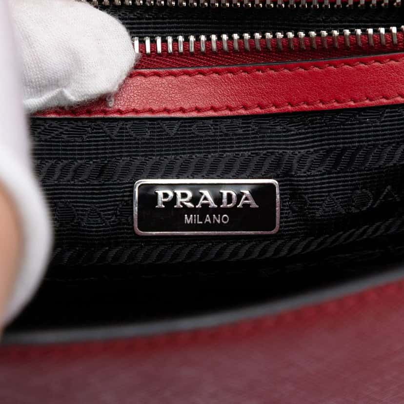 Prada Saffiano Double Turn Lock Top Handle Bag Red Leather Very good condition - Box View