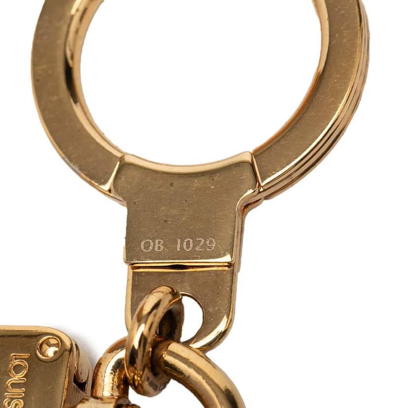 Louis Vuitton Gold Plated and Resin Confidence Bag Charm and Key Holder Gold Metal Very good condition - Model View