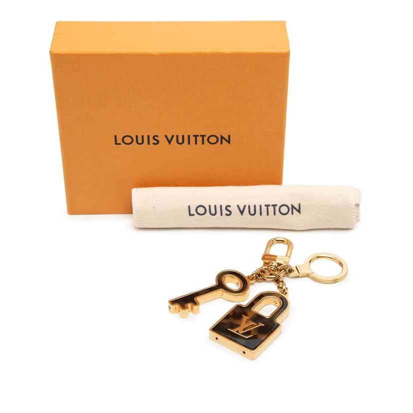 Louis Vuitton Gold Plated and Resin Confidence Bag Charm and Key Holder Gold Metal Very good condition - Box View