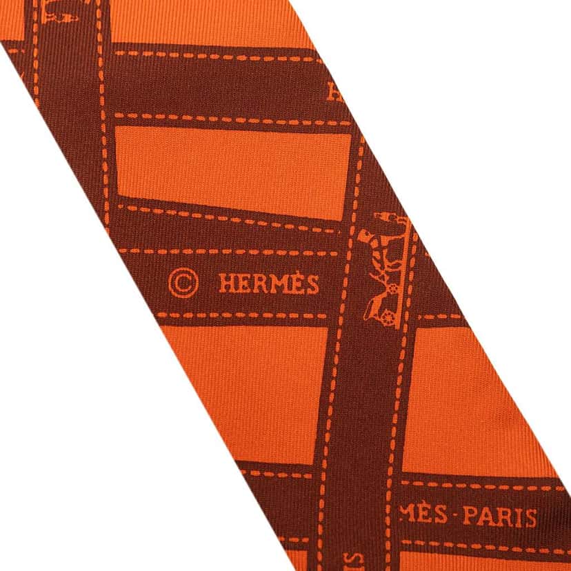 Hermès Bolduc Silk Twilly Scarf Orange Silk Never worn - Model View