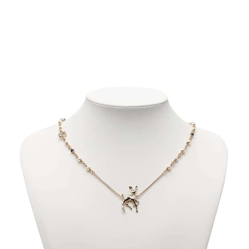 Chanel CC Brass Faux Pearl and Strass Deer Pendant Necklace Gold Metal Very good condition - Model View