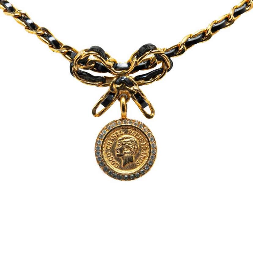 Chanel Leather and Gold Plated Medallion Bow Pendant Necklace Gold Metal Good condition - Front View